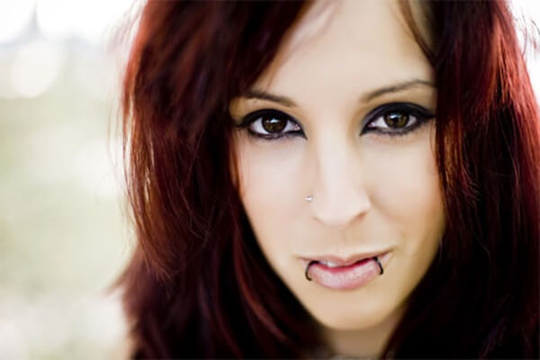 Young beautiful redhair woman portrait staring at camera